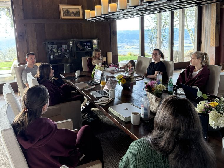 The Bossbabe team gathered around a long table
